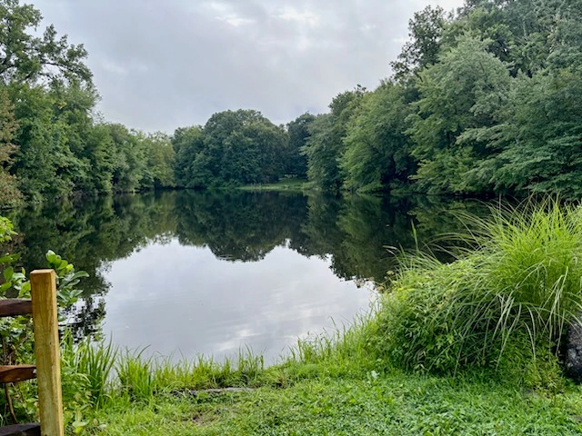 Kaplan's Pond on August 23, 2026, with clear, reflective water